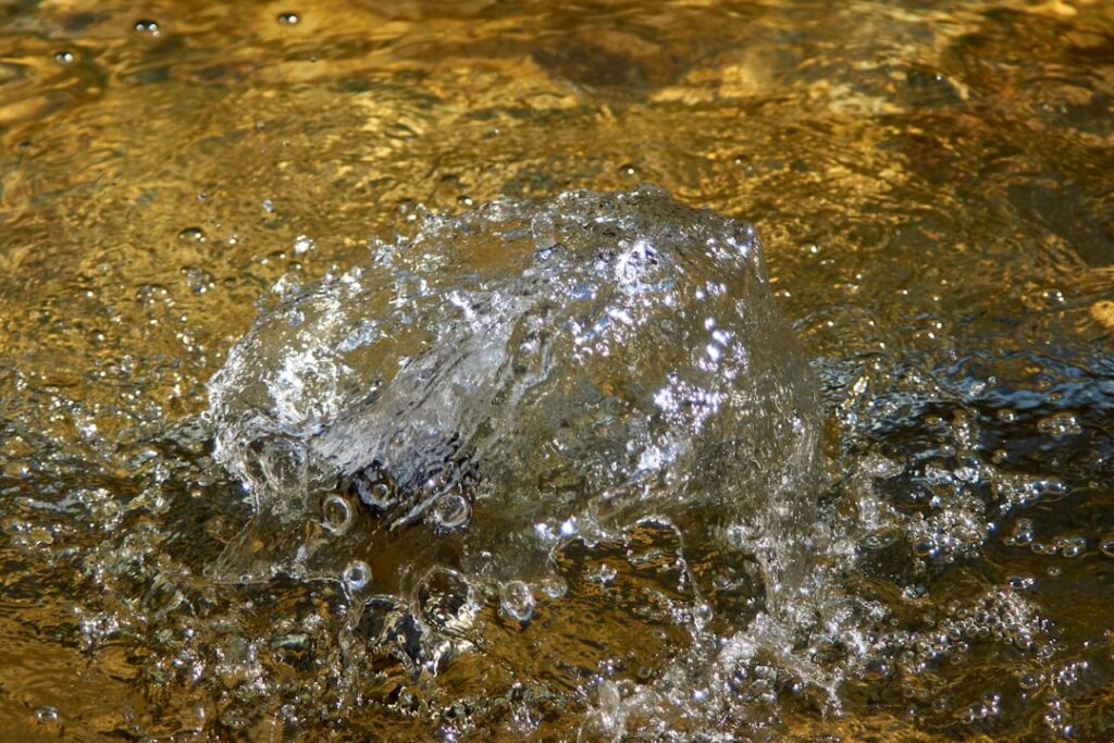 water splash on brown sand
