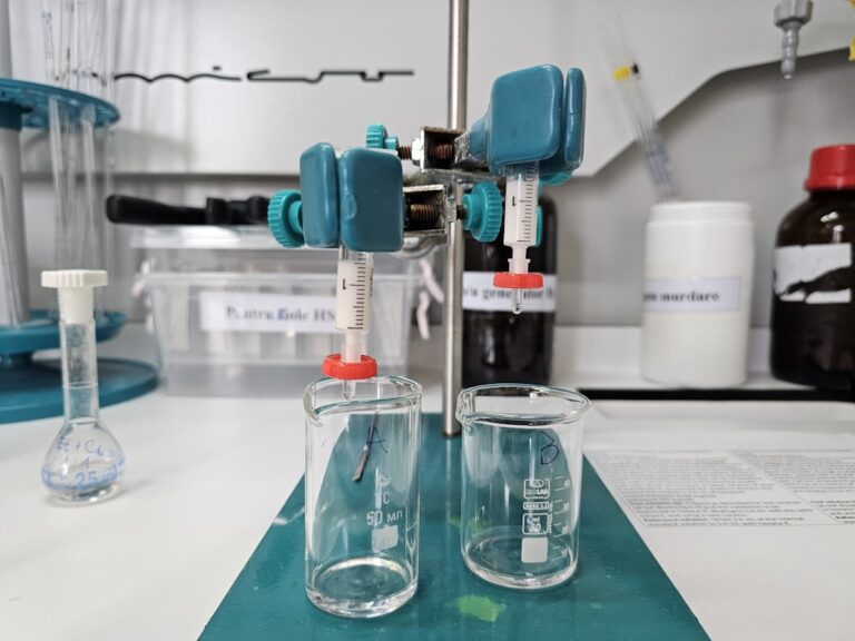 A table topped with two glasses filled with liquid