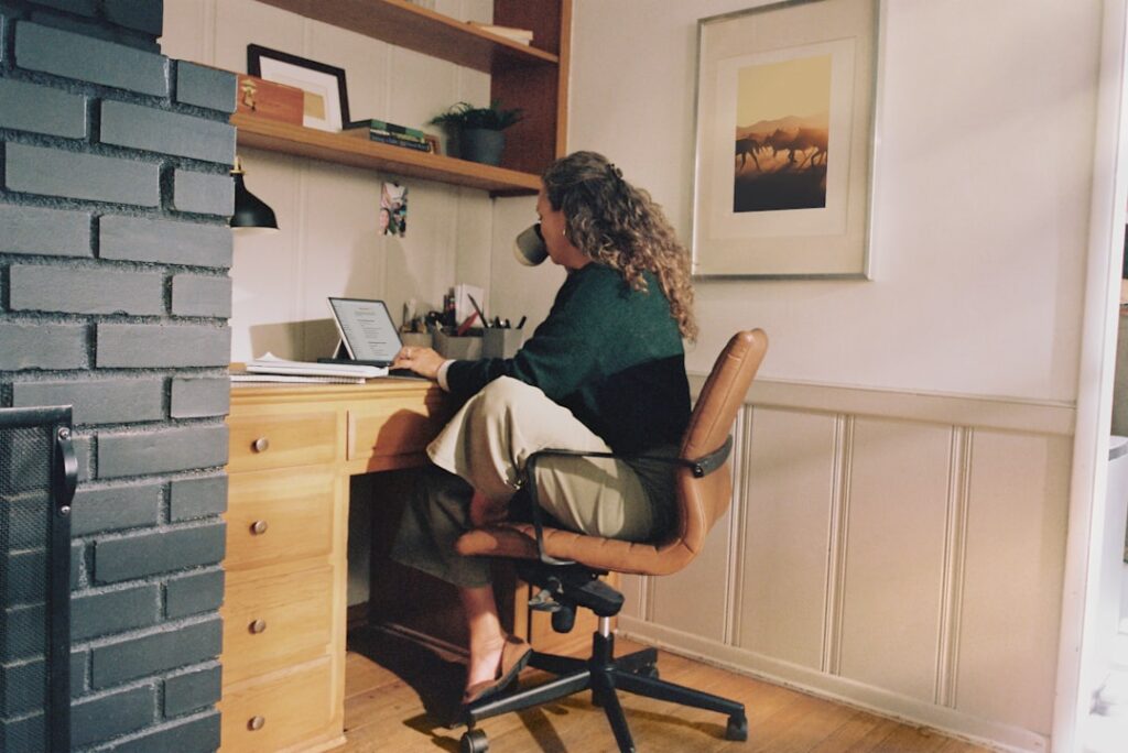 Woman working at desk with coffee