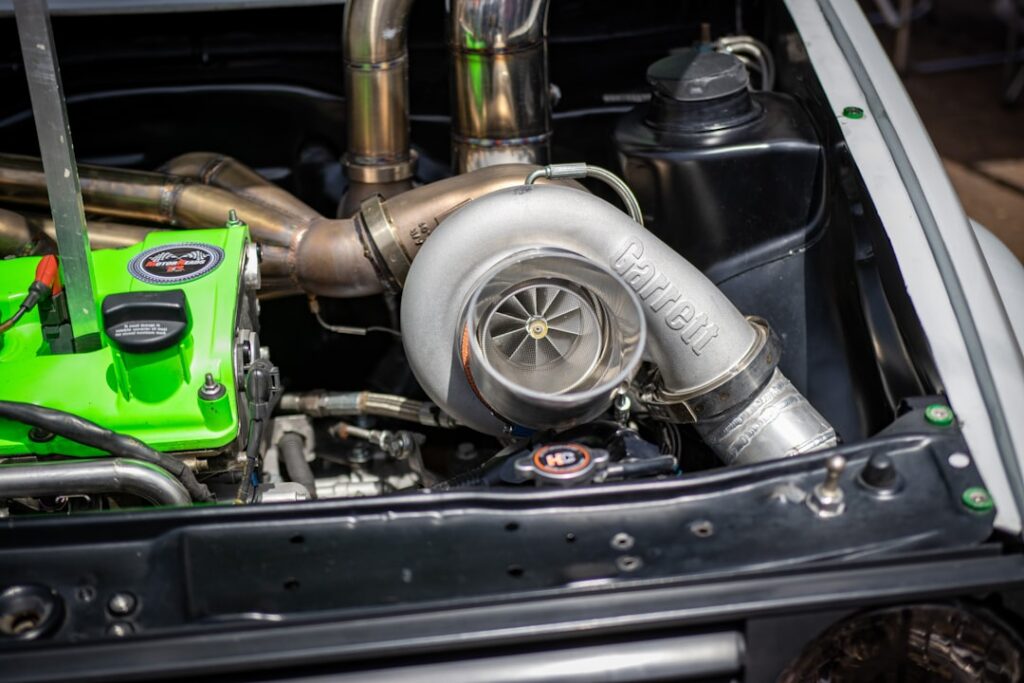 the engine compartment of a car with a green engine
